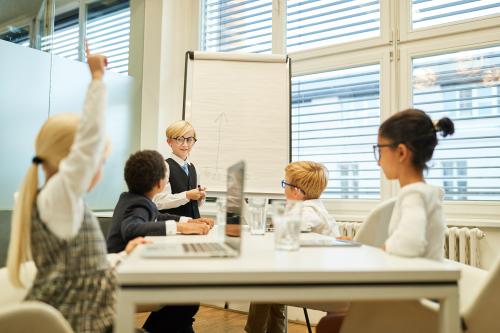 Children playing office meeting