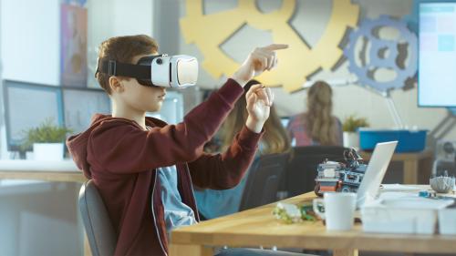 Young boy using a virtual reality headset