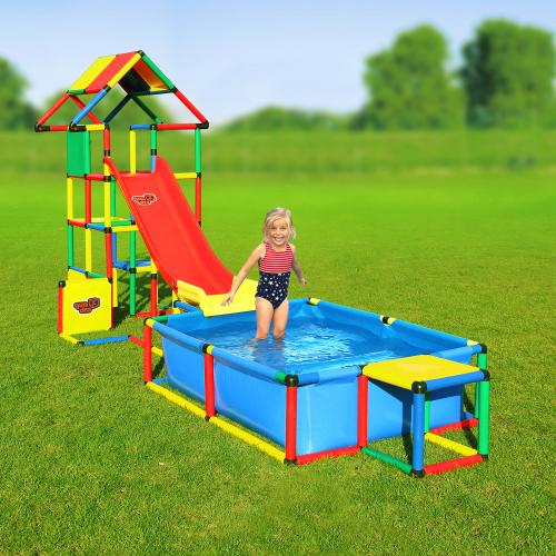 Girl standing in a pool in front of a jungle gym