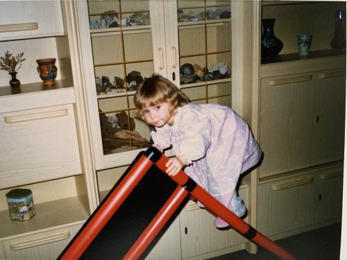 A girl on top of an old QUADRO jungle gym