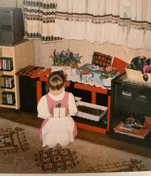 Girl unboxing presents on Christmas